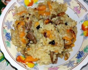 Плов с куриными сердечками 